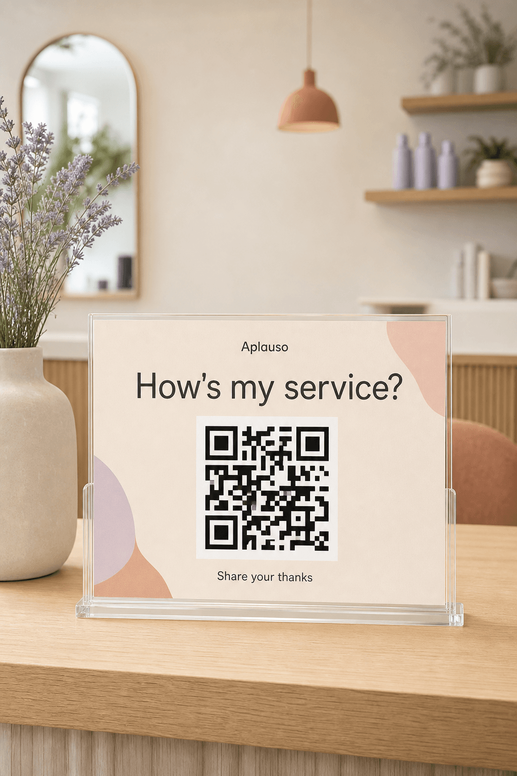 An elegant Aplauso appreciation sign displayed at a modern service studio welcome counter